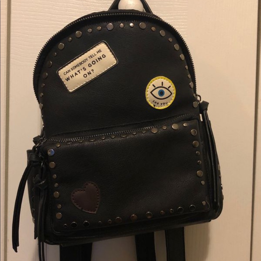 Black studded evil eye backpack